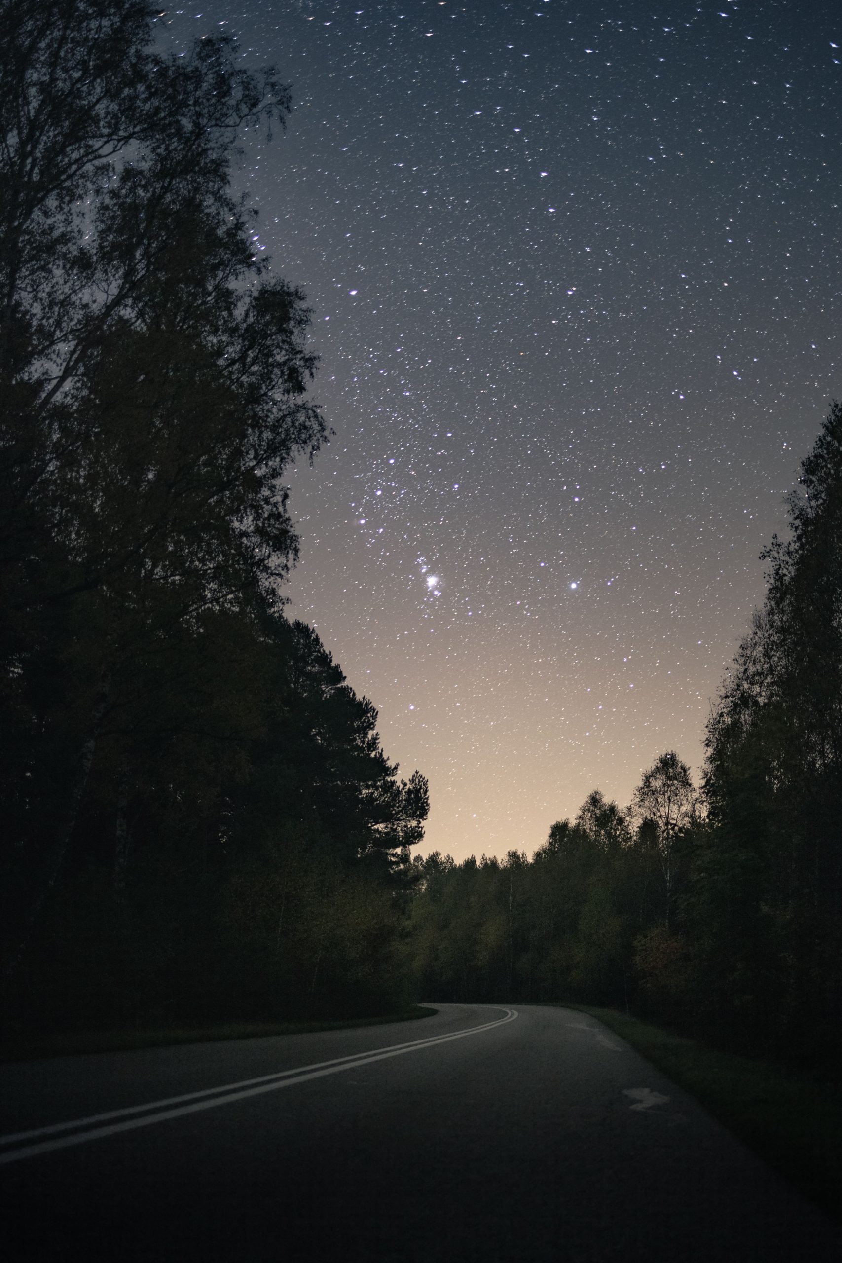 Generic stock photo of a house at dusk with an illuminated driveway