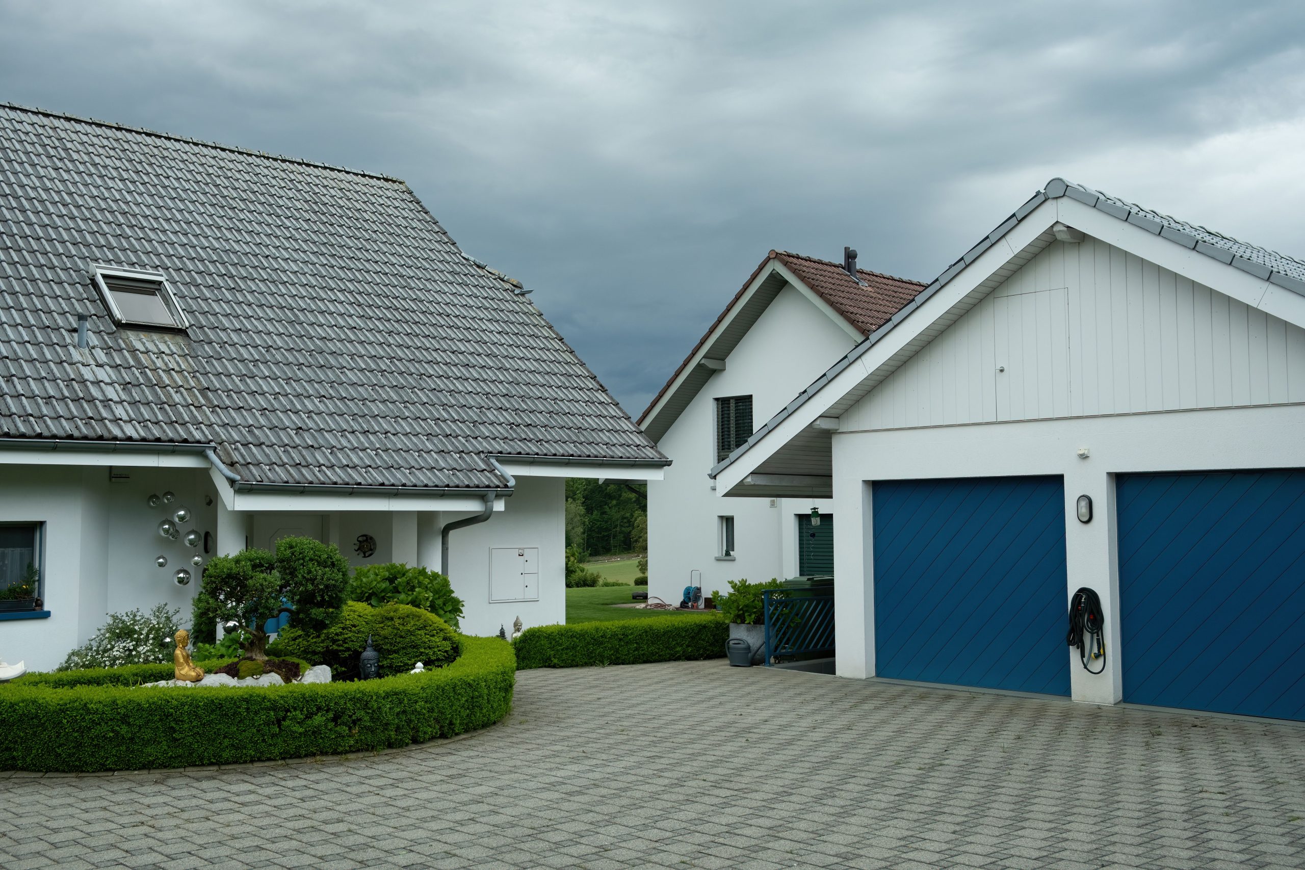 Generic stock photo of a modern paved driveway in front of a house