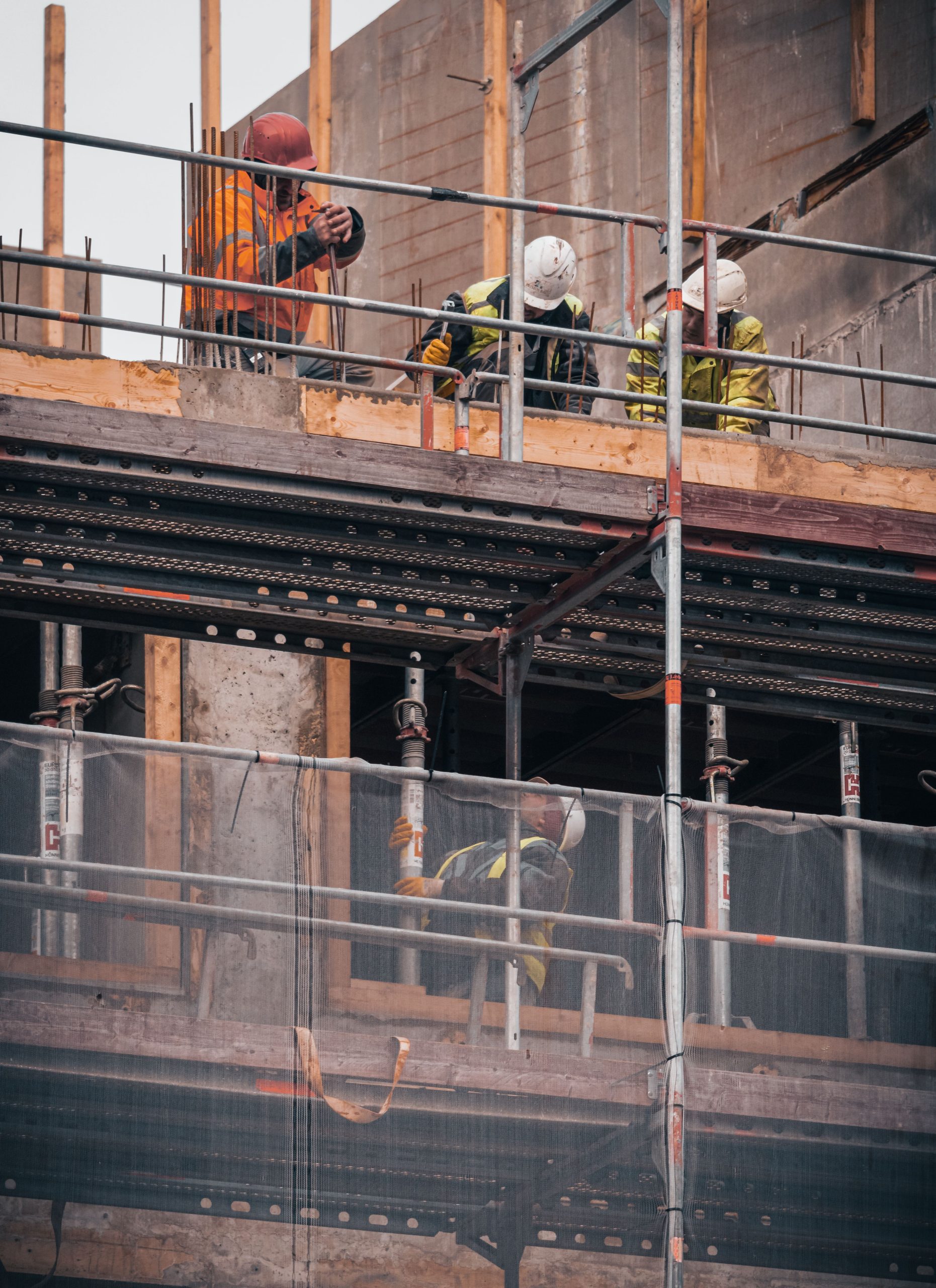 Generic stock photo of a worker repairing a paved surface